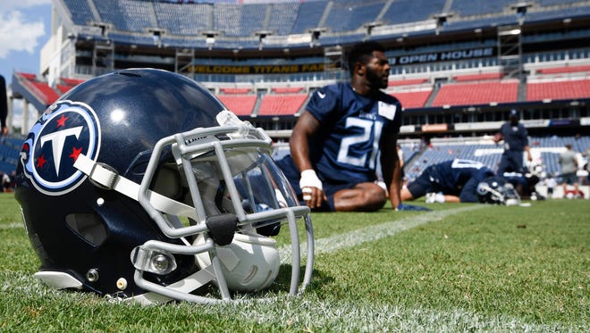 Titans players warm up during a training camp practice Saturday at Nissan Stadium.