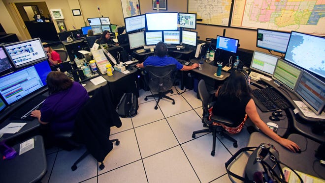 Dispatchers monitor calls from their work station at Metro Communications inside the Minnehaha County Jail. Metro Communications is adding two power shifts to its daily schedule to help with peak call volume times.