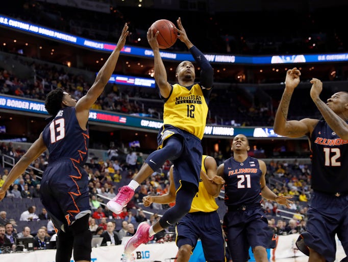Michigan guard Muhammad-Ali Abdur-Rahkman (12) shoots