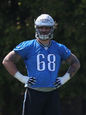 Detroit Lions' Taylor Decker watches drills on Friday, May 6, 2016 at the practice facility in Allen Park.