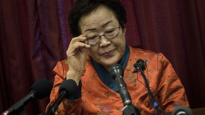 Lee Yong-soo pauses during a news conference by the Washington Coalition for Comfort Women Issues on Capitol Hill April 23, 2015 in Washington, DC. Lee Yong-soo, a Korean national, was the victim of sex crimes by Japanese military during World War II.