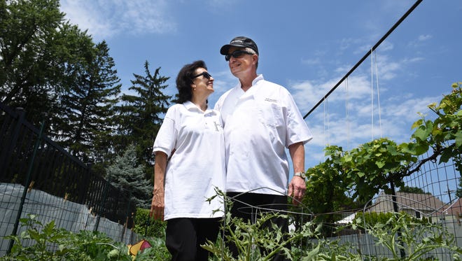 The husband-and-wife team of Bob and Mary Silvestri created their own line of pesto-inspired products which are built on organic, locally sourced basil leaves. The couple are shown beside their home garden in Clifton.