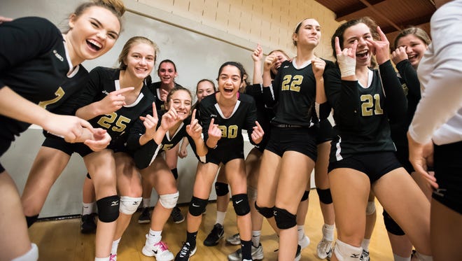 Delone Catholic volleyball players celebrate following their PIAA state semifinal win against West Shamokin in State College Nov. 14, 2017. The Squirettes won in three sets, 25-19, 25-14, 25-16, and will play in the championship game Saturday.