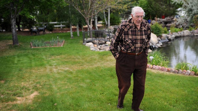 Long time Reno resident Dick Lowden is seen walking his property off of Meadowview Lane on May 13, 2015.