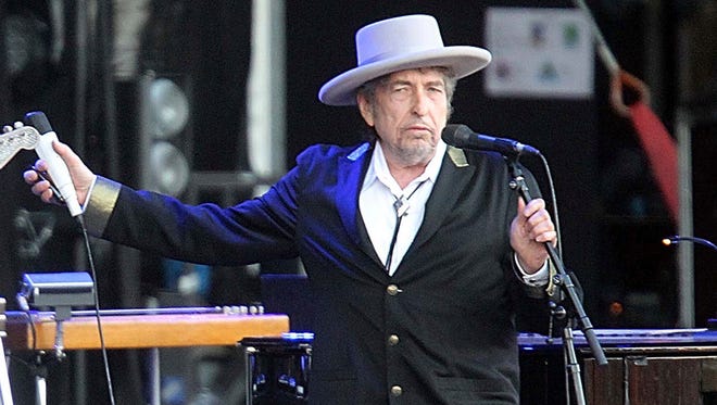 This July 22, 2012, file photo shows U.S. singer-songwriter Bob Dylan performing onstage at "Les Vieilles Charrues" Festival in Carhaix, western France.