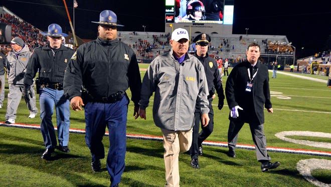 LSU Tigers head coach Les Miles walks off the field after the game against Ole Miss at Vaught-Hemingway Stadium.