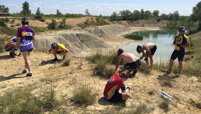 RAGBRAI riders stop to hunt fossils at the Fossil and Prairie Park Preserve in Rockford on July 24, 2014.