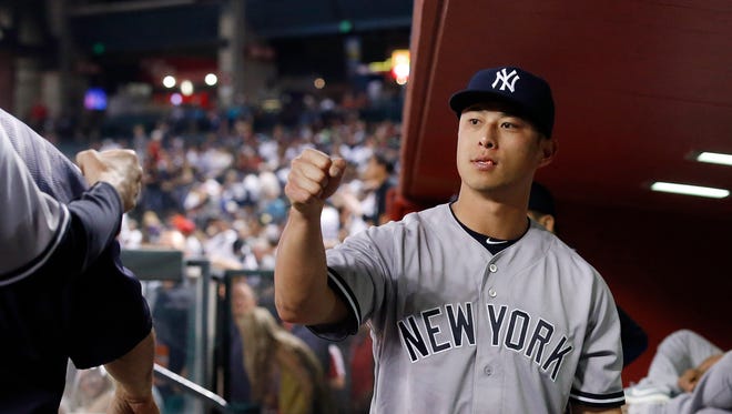 New York Yankees' Rob Refsnyder gives out a fist pump prior to a baseball game against the Arizona Diamondbacks Tuesday, May 17, 2016, in Phoenix. The Diamondbacks defeated the Yankees 5-3.