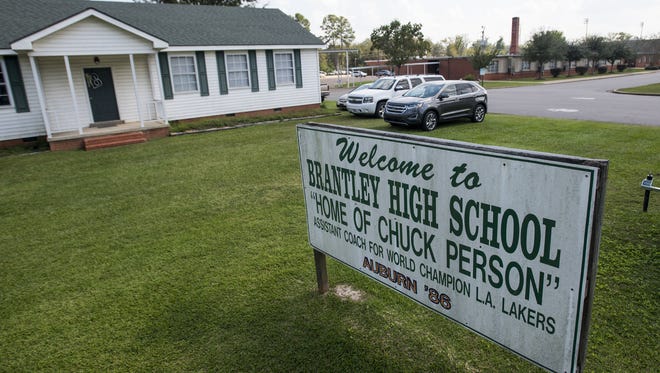 A sign touting Brantley High School graduate Chuck Person in front of the school in Brantley, Ala. on Friday September 29, 2017.