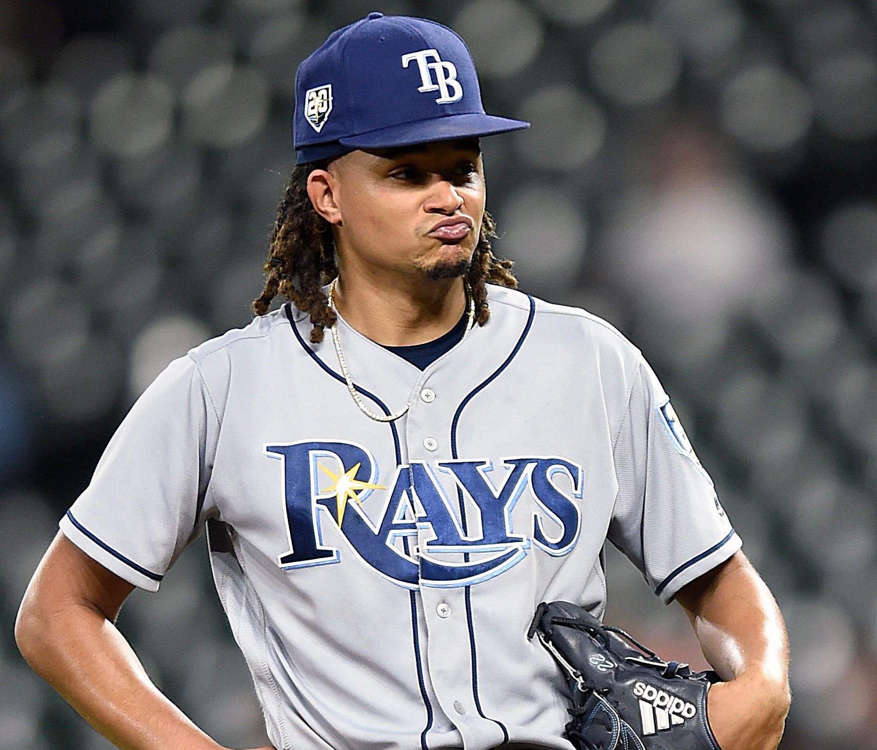 Tampa Bay Rays' Chris Archer reacts after giving up a base hit against the Baltimore Orioles in the fourth inning of a baseball game, Friday, July 27, 2018, in Baltimore. (AP Photo/Gail Burton)