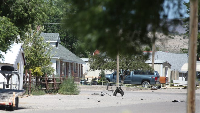 Shrapnel from a Wednesday night bombing that killed one person sits on a street in Panaca, Nev., on Thursday, July 14, 2016. (Brett Le Blanc/Las Vegas Review-Journal via AP)