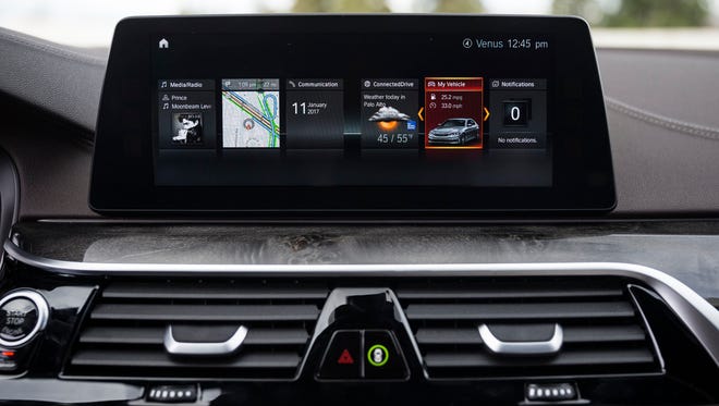The 2017 BMW 5-series' wi-fi hot spot wirelessly transmits Apple CarPlay's smart phone apps to the car's touch screen.