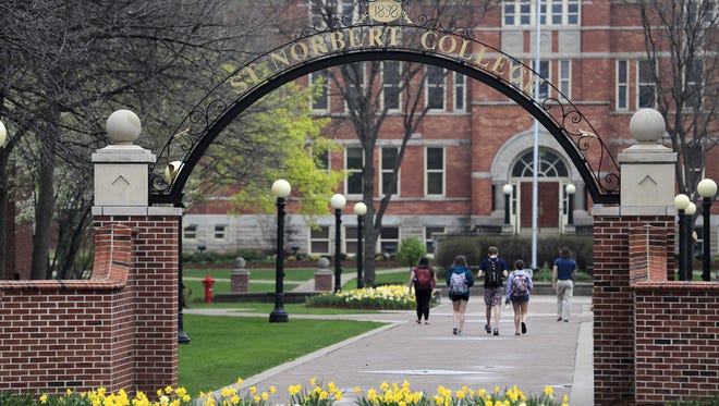 Students walk across the St. Norbert College campus last spring.