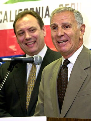 In this June 20, 2001, file photo, Republican gubernatorial candidate, Secretary of State Bill Jones, left, looks on as former California Gov. George Deukmejian answers questions during a news conference in Sacramento. A former chief of staff says two-term California governor George Deukmejian, whose anti-spending credo earned him the nickname "The Iron Duke," has died at age 89. Steve Merksamer says Deukmejian died Tuesday, May 8, 2018, of natural causes.