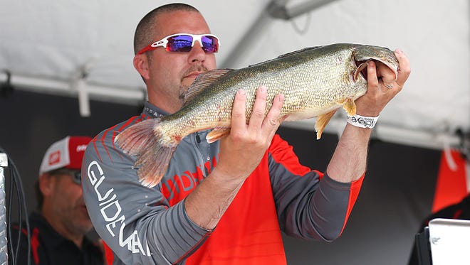 Chad Meinburg holds up the heaviest walleye caught in the Mercury Marine National Walleye Tournament Sunday, June 11, 2017. Meinburg’s catch weighed in at 8.24 pounds. Doug Raflik/USA TODAY NETWORK-Wisconsin