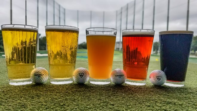 At Top Golf in Edison, you can swing the old golf clubs around and enjoy some drinks at any time of the year.