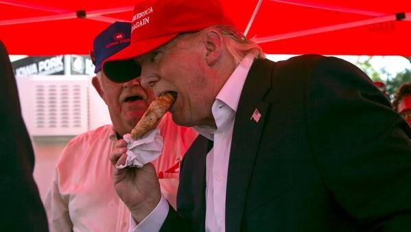 Republican presidential hopeful Donald Trump eats a pork chop at the Iowa State Fair on Saturday, August 15, 2015.