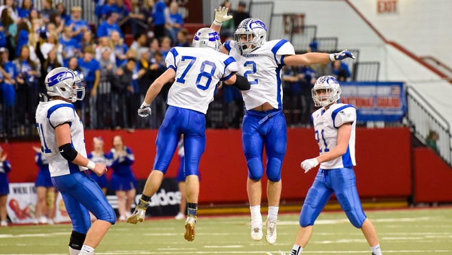 Bridgewater-Emery/Ethan linebacker Jamin Arend (2) and linebacker Zack Leithieser (78) celebrate Arend's interception during the second half of the Class 11B football state championship game on Nov. 10, 2017 in Vermillion, S.D.. Sioux Falls Christian beat Bridgewater-Emery/Ethan 27-12.
