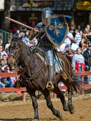 A jousting knight spurs on his charger at the Arizona Renaissance Festival.