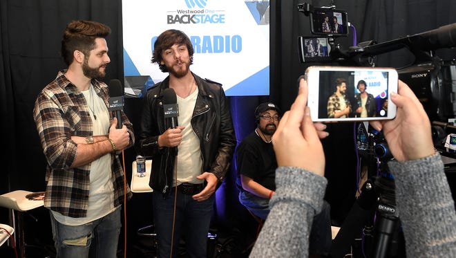 Thomas Rhett talks with Chris Janson at the Academy of Country Music (ACM) Radio Row where artists connect with the radio community. Friday March 31, 2017, in Las Vegas, NV