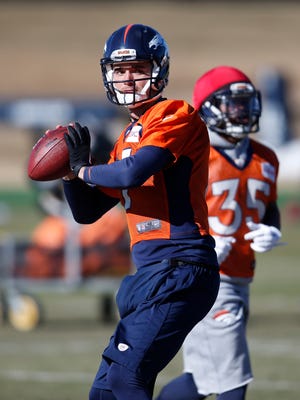 FILE - In this Jan. 21, 2016, file photo, Denver Broncos quarterback Brock Osweiler passes during an NFL football practice at the team's headquarters in Englewood, Colo. Now that the Broncos have bid their farewells to quarterback Peyton Manning, who retired on Monday, March 7, the team hopes that his backup, Osweiler, will stay on to take up the reins of Super Bowl champions' offense. (AP Photo/David Zalubowski, File)