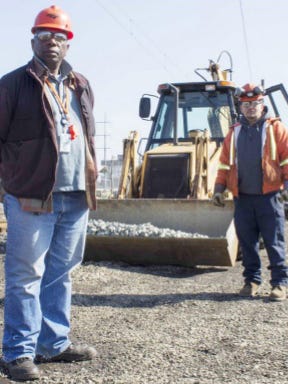 In this image from an April 2015 Amtrak newsletter, Amtrak workers Joe Carter (left) is shown with Victor Mercado. Carter died in Amtrak's crash in Chester, Pennsylvania, on Sunday, friends said Monday.