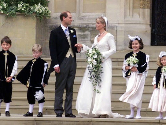 Prince Edward with his wife, Sophie Rhys-Jones, with her pageboys and bridesmaids as they leave St. George's Chapel at Windsor Castle in June 1999.