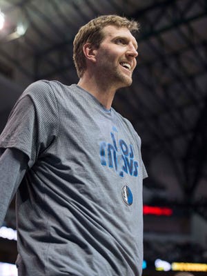 Dallas Mavericks forward Dirk Nowitzki watches his team take on the Memphis Grizzlies during the second half at the American Airlines Center.