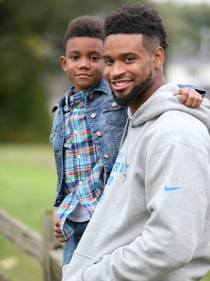 Detroit Lions defensive back Darius Slay, right, with his son Darion Slay, 8, on Sept. 29, 2015.