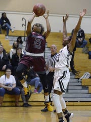 Edison’s Dyaisha Fair, left, drives to the basket against