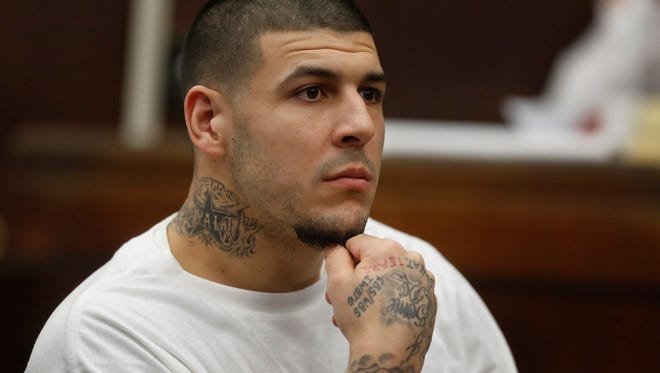 FILE - In this Dec. 22, 2015 file photo, former New England Patriots NFL football player Aaron Hernandez attends a pre-trial hearing at Suffolk Superior Court in Boston. Hernandez is expected to appear in court Thursday, July 21, 2016, with new lawyers to defend him in the 2012 slayings of two men outside a Boston nightclub.