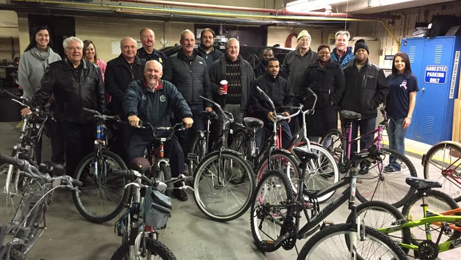 The Port Huron Police Department on Thursday gave away 16 bicycles that had not been claimed to pastors of area churches. From left, front row are Phil Seppo, Croswell-Lexington Assembly of God; Jim Turner, Marsyville Assembly of God; Tom Seppo, Operation Transformation; Bruce Clark, Blue Water Christian Church, Bill Kinnan, Hillside Wesleyan Church; Trey Smith, Faith Christian Church; Kathy Rivers, New Covenant Life Church; Brian Rivers, New Covenant Life Church; and Ashly Bauman, Port Huron Police Department. Back row, from left, are Jackie Martin, Port Huron Police; Jenny Leach, Port Huron Police; Lt. Joe Platzier, Port Huron Police; Stephen Anderson, Mount Pleasant Bible Church, John Thomason, Kingdom Empowerment Ministry; John Minor, Mount Pleasant Bible Church; and Joe Sazyc, Port Huron Assembly of God.