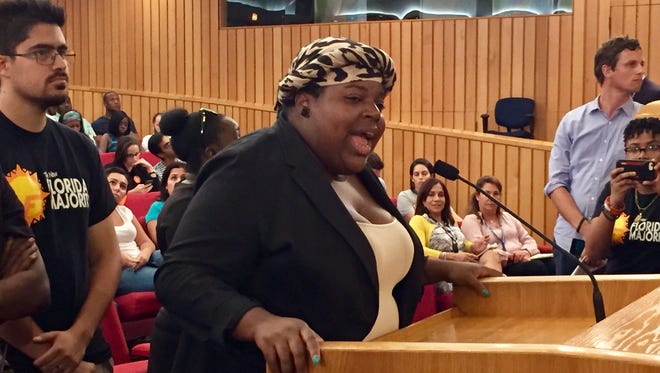Miami community activist Valencia Gunder questions the response from county officials following Hurricane Irma during a meeting of the Miami-Dade County Commission on Sept. 19, 2017.