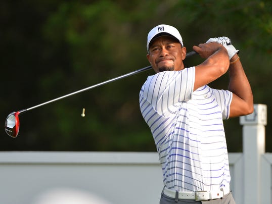 Tiger Woods, preparing for his tournament, plays pain free