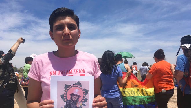 In this Wednesday, June 6, 2018 file photo, Gabriela Hernandez, executive director of the nonprofit New Mexico Dream Team, holds up an image in Albuquerque, N.M, of a Honduran transgender woman who died while in U.S. custody last month. Several migrants told New Mexico lawmakers Monday, July 16, 2018, that they were denied medication and adequate treatment while detained inside two different federal immigration facilities in the state. Joselin Mendez, of Nicaragua, blamed the death of Roxsana Hernandez, a Honduran transgender woman who died in the custody of the U.S. Immigration and Customs Enforcement, on the lack of sufficient medical treatment.