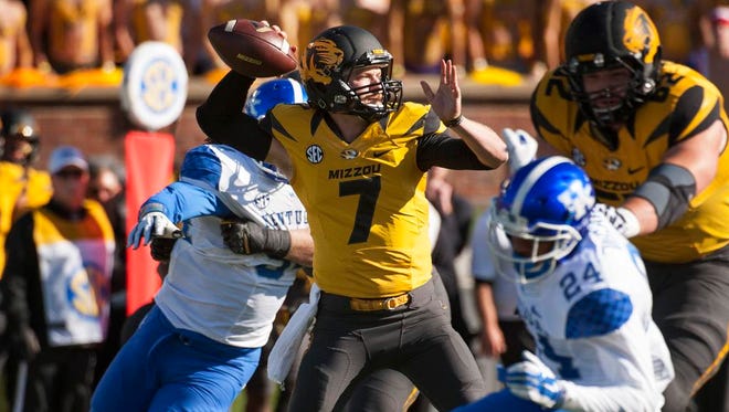 Missouri quarterback Maty Mauk sets to throw during the first quarter of an NCAA college football game against Kentucky, Saturday, Nov. 1, 2014, in Columbia, Mo.