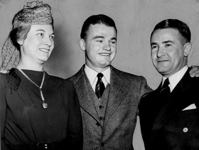 Feb. 14, 1940 - Nile Kinnick with his parents at the