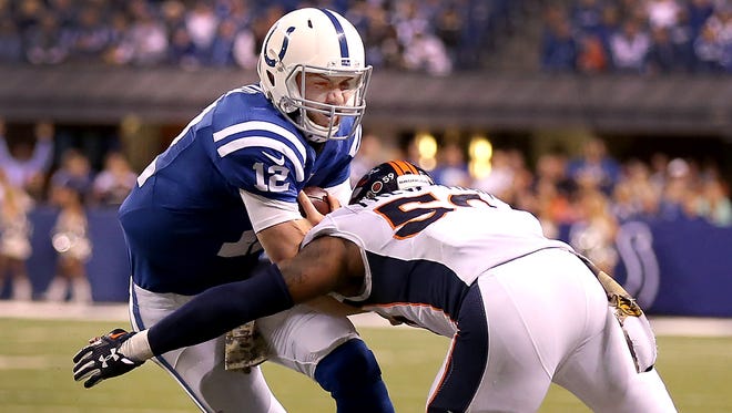 Andrew Luck grimaced in the face of the tackle by  linebacker Danny Trevathan early in the  fourth quarter of Sunday's game.