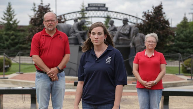 UAW Local 5960 member Jennifer Sanders poses for a photo with her parents, Roy Richard of Burton and Kris Richard, former UAW members, at the Sitdown Strike Memorial on the grounds of the UAW Region 1C in Flint.
