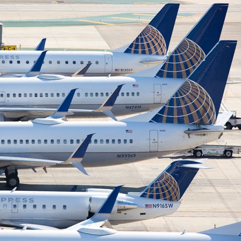 A gaggle of United Airlines tails fill the ramp of