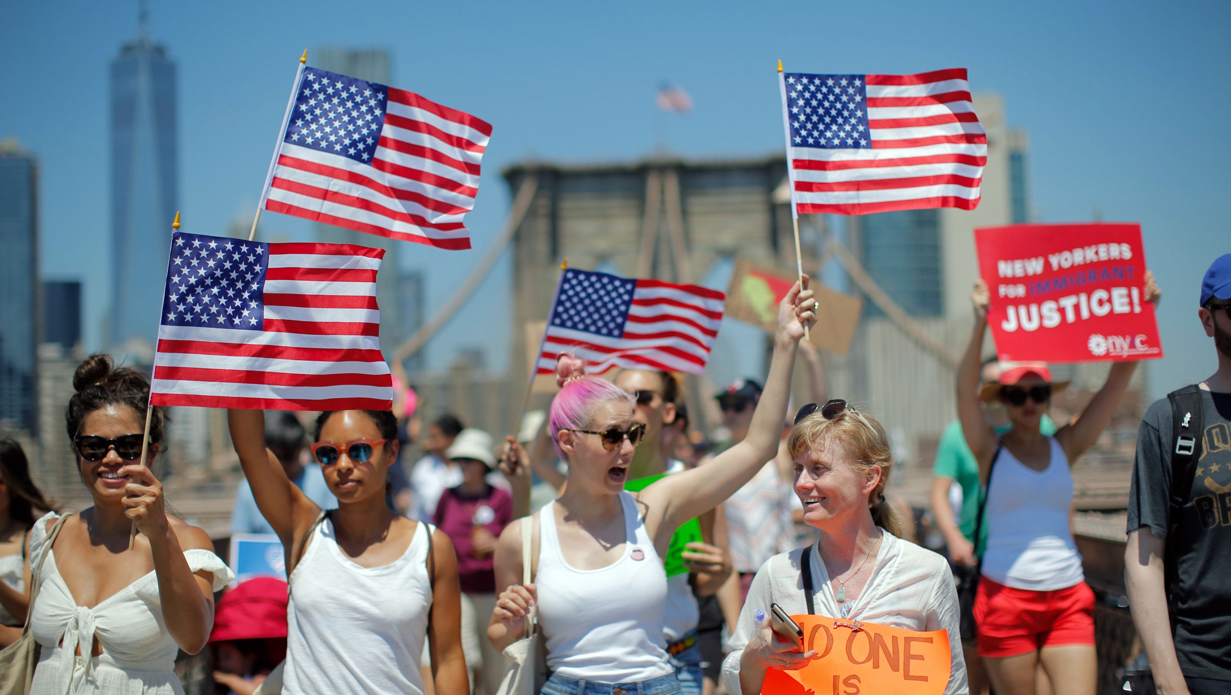 Demonstrators cross the Brooklyn Bridge during the