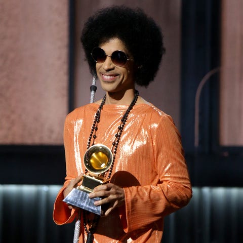 Singer/songwriter Prince speaks onstage during...