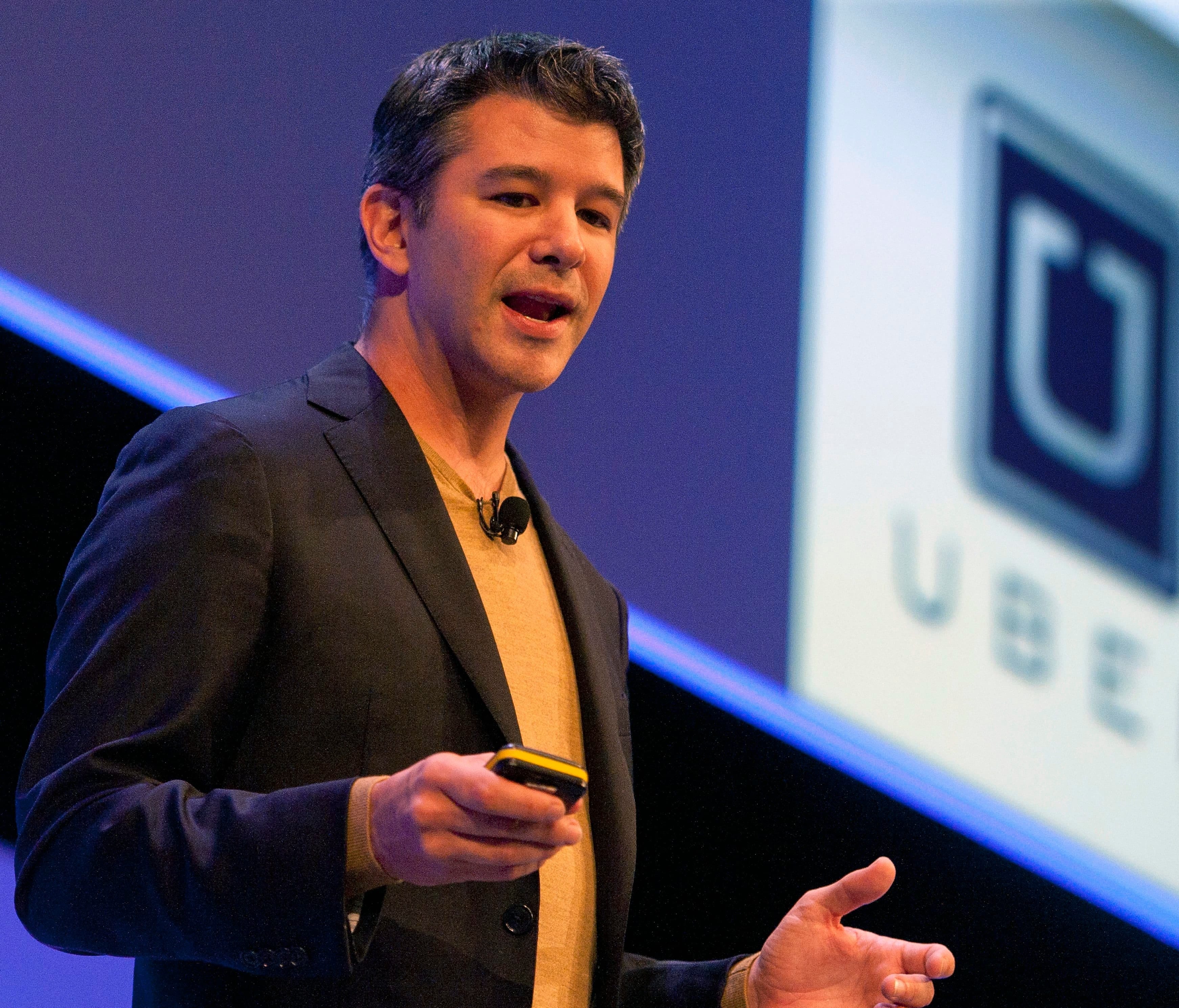 Former Uber CEO Travis Kalanick delivers a speech in London on October 3, 2014.