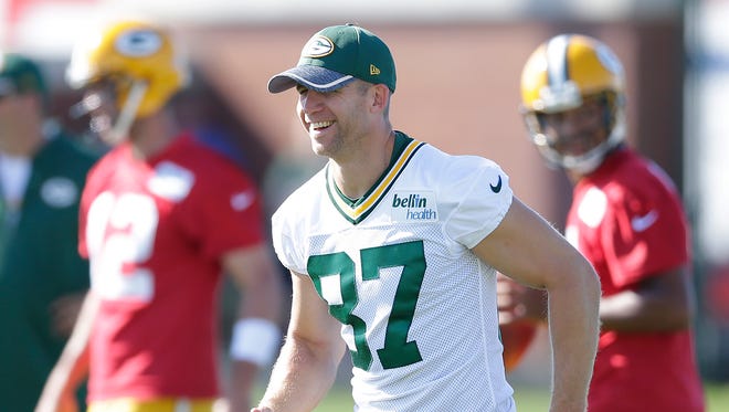 Receiver Jordy Nelson smiles watching drills (87) during Green Bay Packers Training Camp at Ray Nitschke Field.