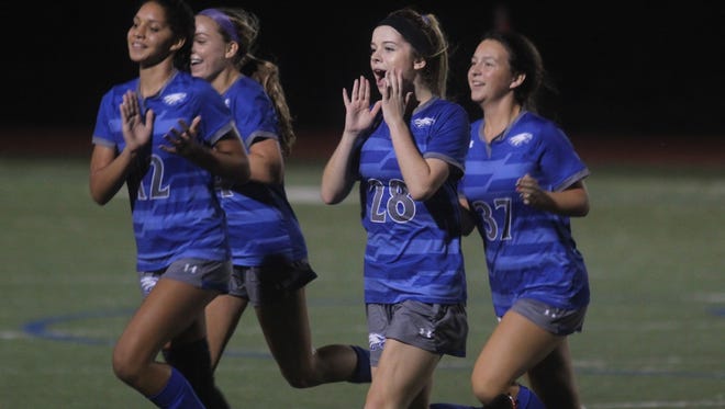 Scott players celebrate their win during the 37th District girls soccer semifinals between Scott and Calvary Christian Oct. 8, 2018 at Scott High School. Scott won 5-4 in PKs after a 2-2 draw.