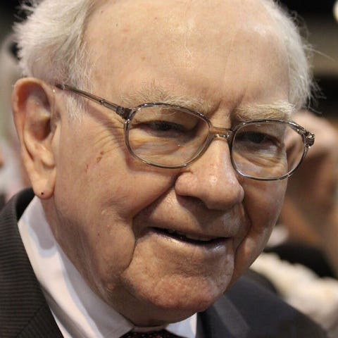 Berkshire Hathaway CEO Warren Buffett, with other 