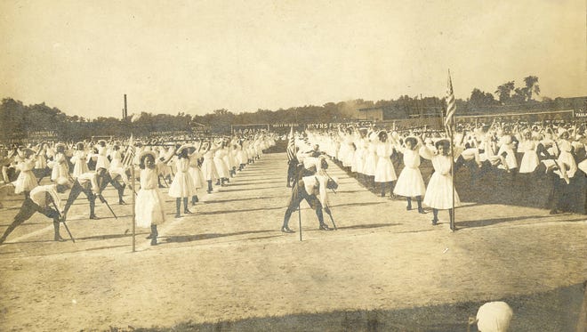 Field Day in 1912, held on May 21 at League Park. This photo shows the “Club Swing Drill”, in which 350 students from the seventh and eighth grade performed a choreographed routine with clubs to the music of the live band.