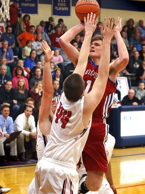 Roncalli throws up a two-man defense against Martinsville High School standout Keegan Northern, who finished with a game-high 28 points against the Rebels in Martinsville's 75-70 win at Roncalli High School on Friday, Jan. 2, 2015. Northern was the game's high scorer with 28 points.