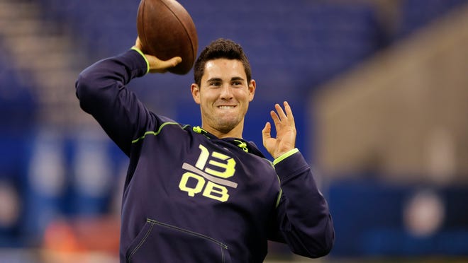 FILE - In this Feb. 23, 2014, file photo, Georgia quarterback Aaron Murray throws during a drill at the NFL football scouting combine in Indianapolis. While his buddies were bunking down to watch Jack Bauer on “24,” or cruising through channels in search of a ballgame, Kansas City Chiefs quarterback Aaron Murray was settling in for another episode of “The Bachelorette.” Thats because his brother, former minor league baseball player Josh Murray, is one of the eight beaus still in the mix. (AP Photo/Michael Conroy, File)