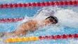 Nathan Adrian (USA) swims during the men's 100-meter